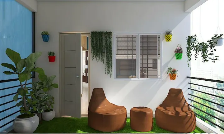 Balcony design with artificial turf, wall-mounted planters and bean bag seating