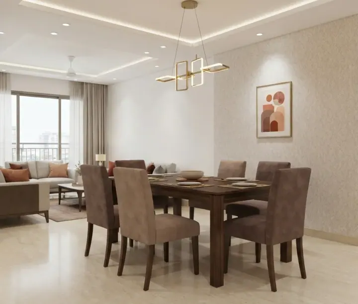 Compact dining area with brown upholstered chairs and a geometric brass pendant