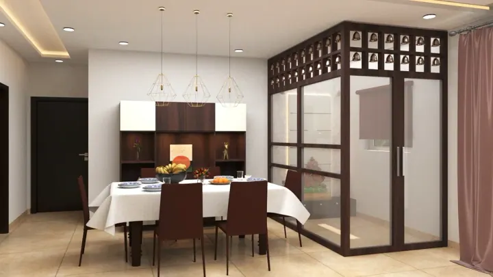 Dining room with a glass and wood partition, pendant lights and a white tablecloth