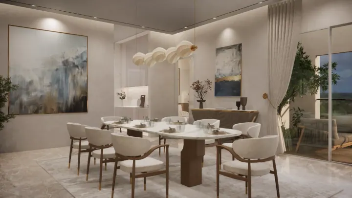 Dining room with a marble table, abstract art and a cluster chandelier