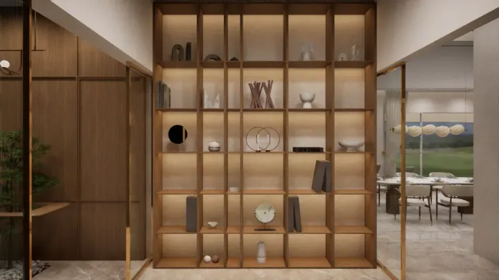 Foyer with a brass-framed display partition looking through to the dining room