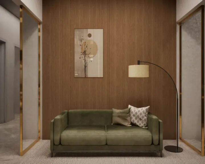 Foyer with an olive velvet sofa, brass trim and wood panelling