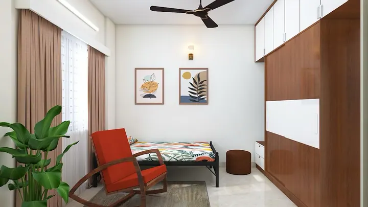 Guest bedroom design with a single bed, rocking chair and framed art