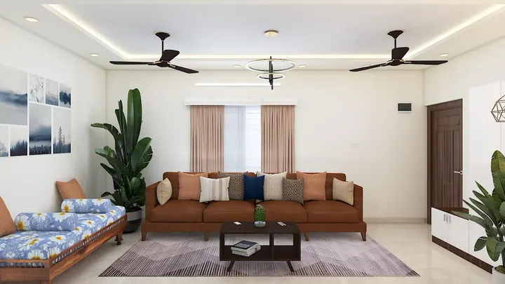 2BHK living room design with a leather sofa, traditional daybed and cove-lit false ceiling