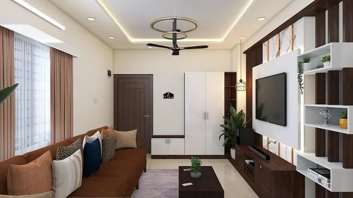 2BHK living room seating arrangement with layered lighting