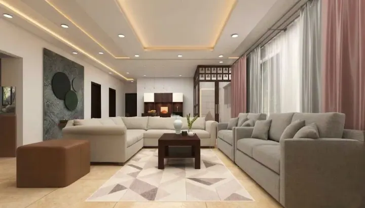 Living room with an L-shaped sofa, geometric rug and a textured wall panel