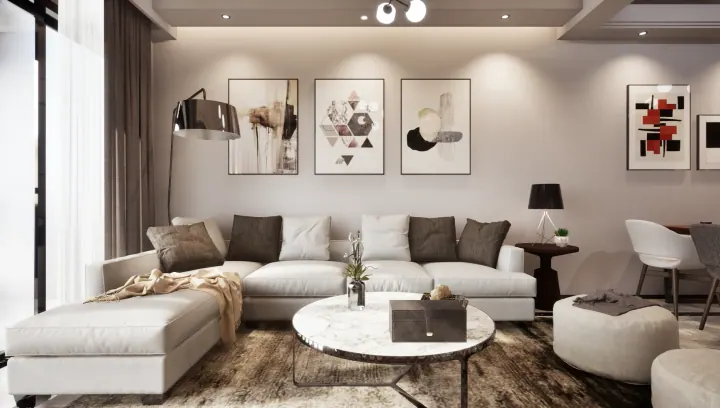 Living room with a white L-shaped sofa and a gallery wall