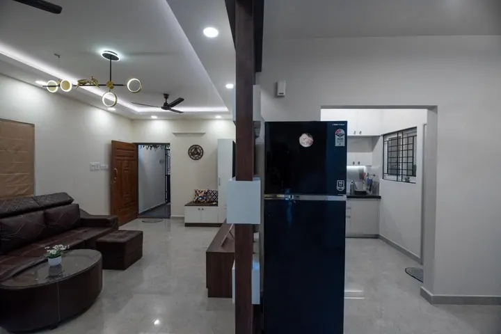 Open plan design showing the living area opening onto the kitchen and entrance foyer