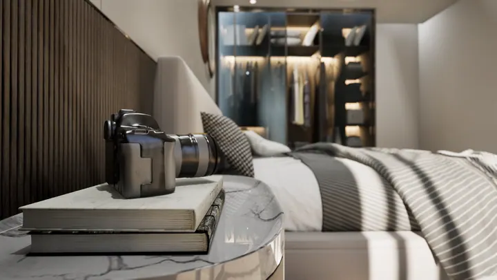 Master bedroom bedside detail with a marble side table and a backlit walk-in wardrobe beyond