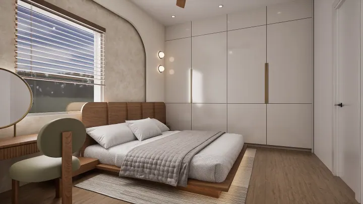 Minimalist bedroom with white wardrobes, a curved headboard and a wooden bench