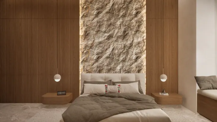 Bedroom with a stone-clad headboard wall between wood panels and floating side tables