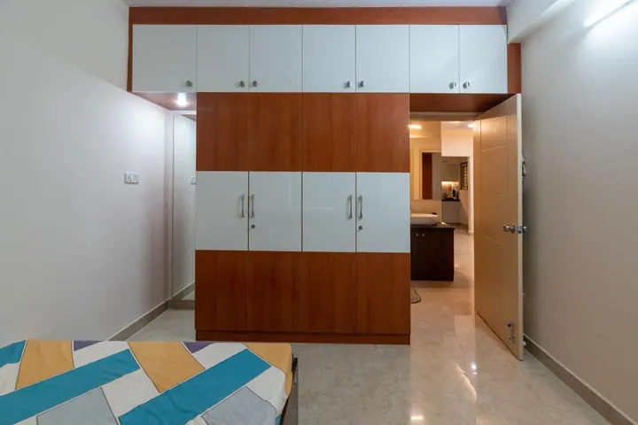 Hinged wardrobe with loft storage in wood and white laminate